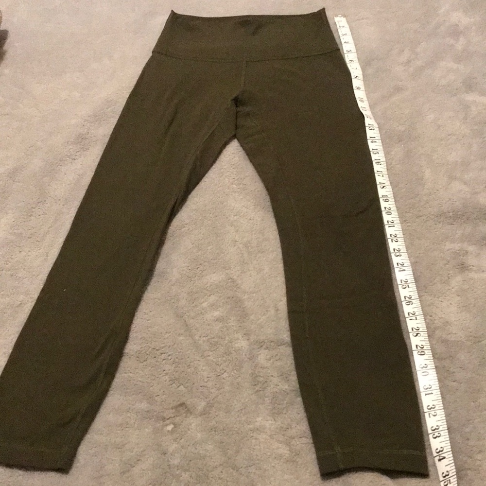 Lulu lemon size 4 olive legging small hole in knee